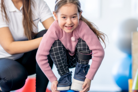 Six-year old girl with special needs balancing