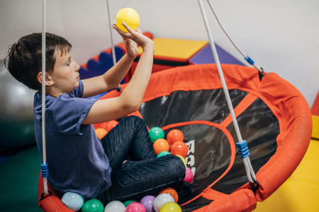 Boy Balancing and Tossing Balls