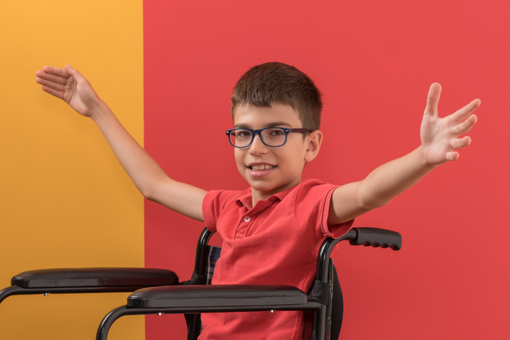 Boy in Wheelchair Happy Arms Raised 